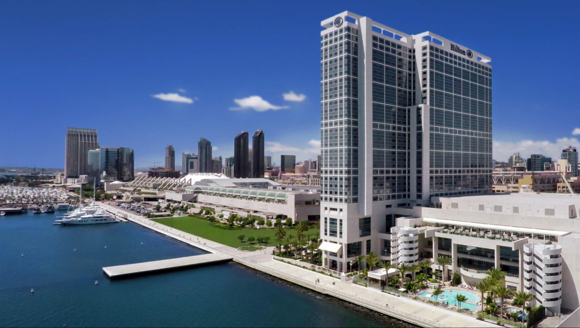 A scenic view of the San Diego Bay area, showcasing the waterfront, boats, and city skyline 