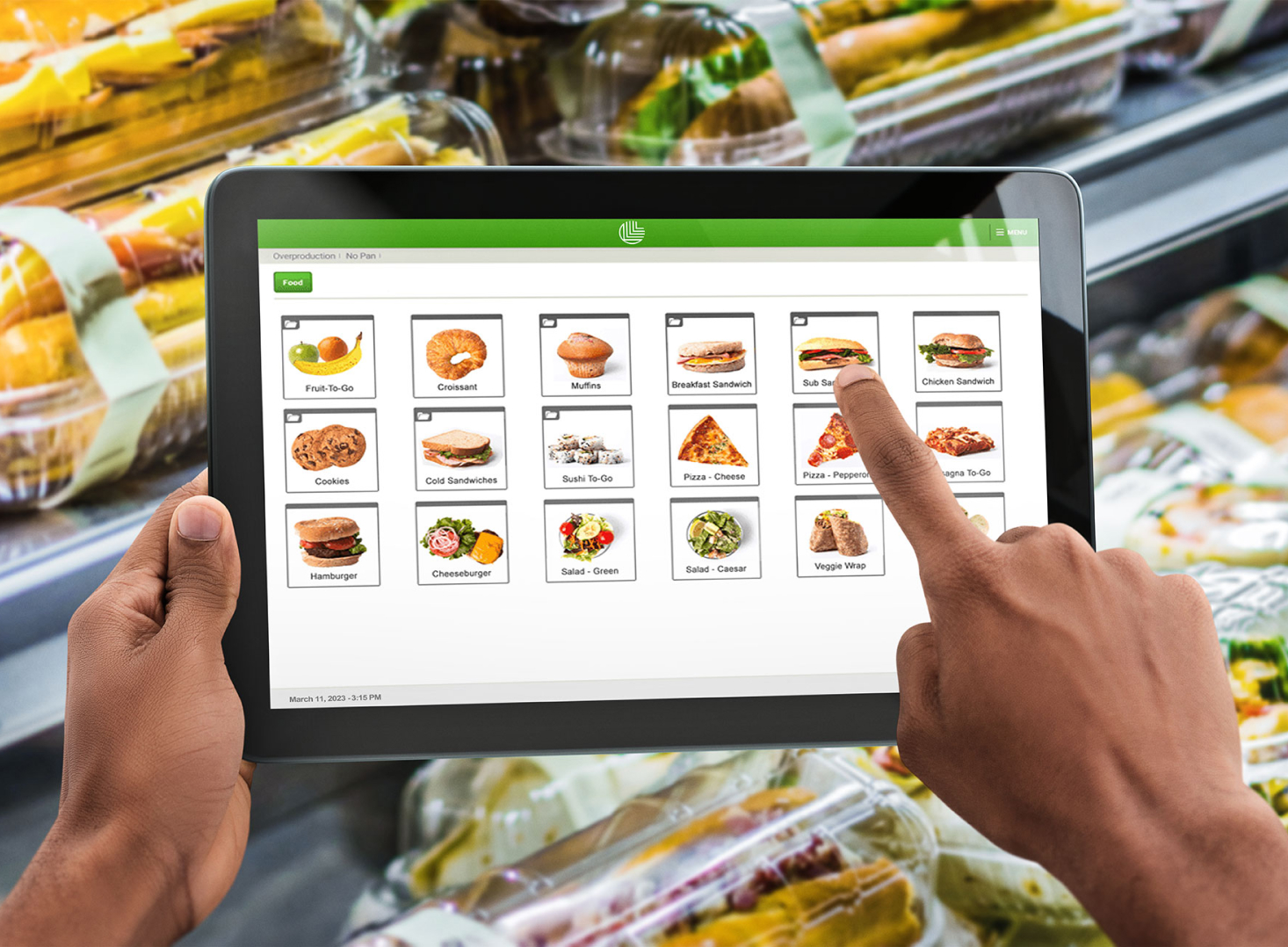 A person using a tablet to browse a food , selecting items 