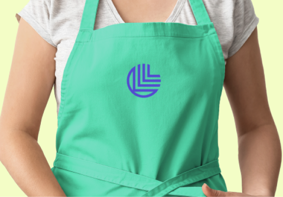 A person wearing an apron with the Leanpath logo on it