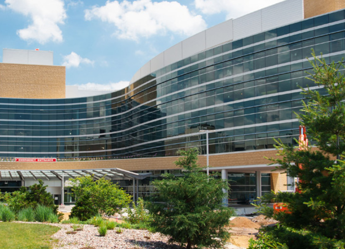 Gunderson Health Systems building surrounded by lush trees and vibrant bushes